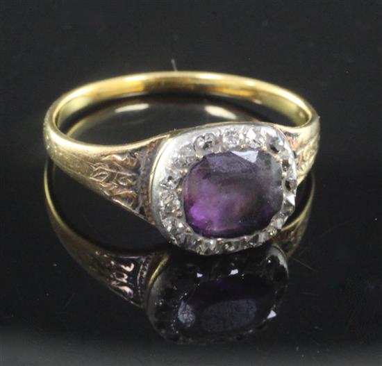 A Georgian gold, amethyst and rose cut diamond set cluster mourning ring, size L.